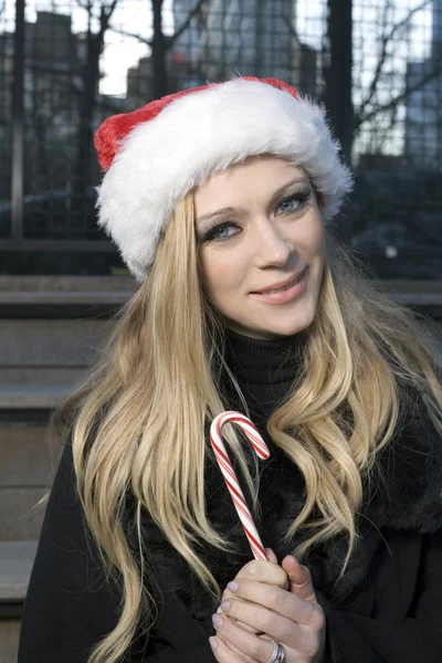 Girl with candy cane — Stock Photo, Image