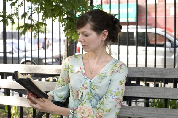 Girl outdoors with Bible — Stock Photo, Image