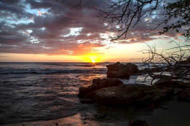 Sunset by the seashore of Rincon beach in Puerto Rico.