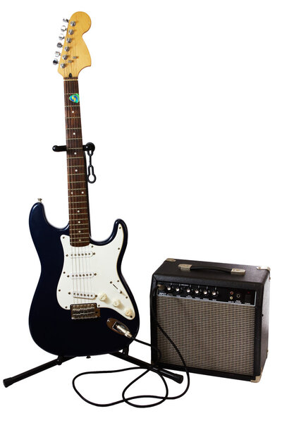 Electric guitar and amplifier isolated on white.