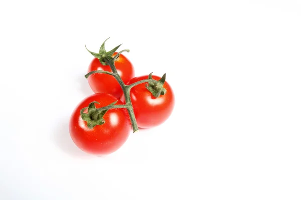 Three cherry tomatoes on white background — Stock Photo, Image