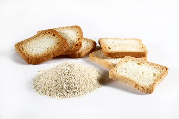 Group biscuits and bread crumbs on white — Stock Photo, Image