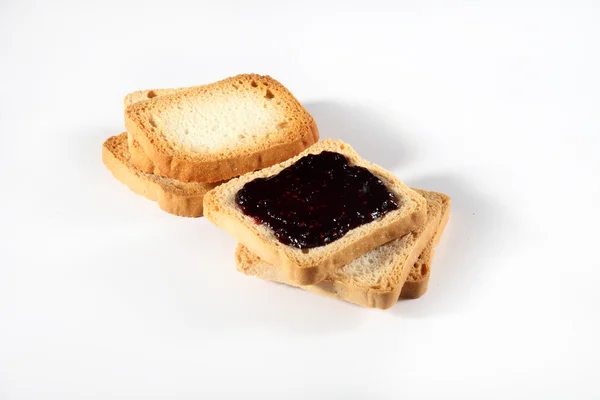 Biscuits with jam on white — Stock Photo, Image