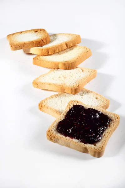 Biscuits with jam on white background — Stock Photo, Image