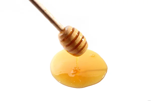 Espolvorear miel sobre blanco — Foto de Stock