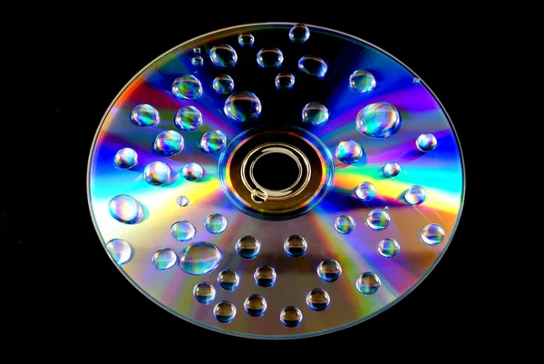 Gotas de água no papel de parede CD — Fotografia de Stock