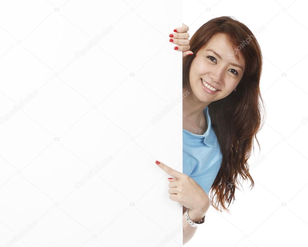 Woman Pointing At Blank Wall