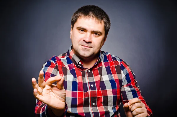 Portrait of man of gesticulating by hands — Stock Photo, Image