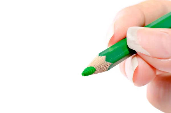 Bilden av en hand som håller en grön penna — Stockfoto