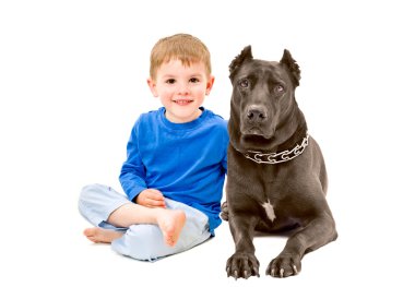 Portrait of cute boy sitting with a dog clipart
