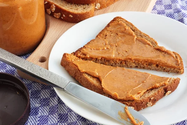 Peanut butter on toast — Stock Photo, Image