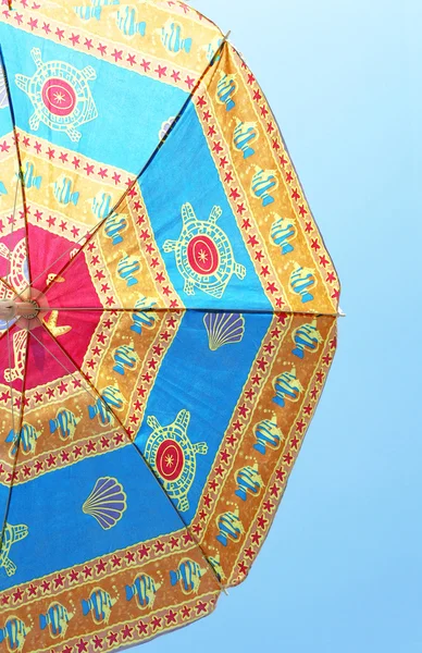Colorful beach umbrella against the blue sky — Stock Photo, Image