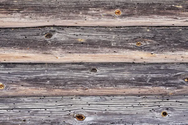 A piece of a wall in a old house made of logs. Wood texture is s — Stock Photo, Image