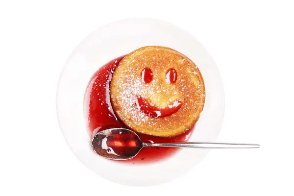 Breakfast with a smiling biscuit on the plate — Stock Photo, Image