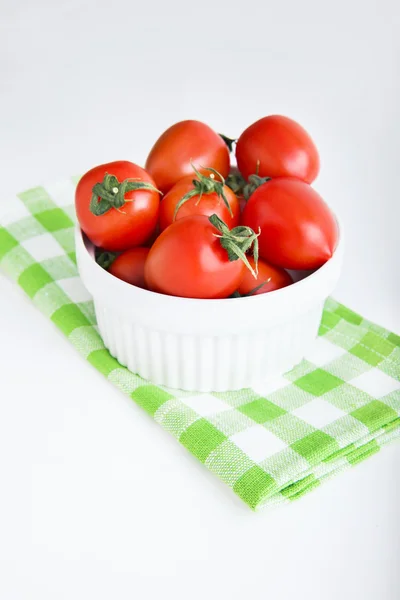 Сherry tomatoes in a bowl on green napkin — Stock Photo, Image