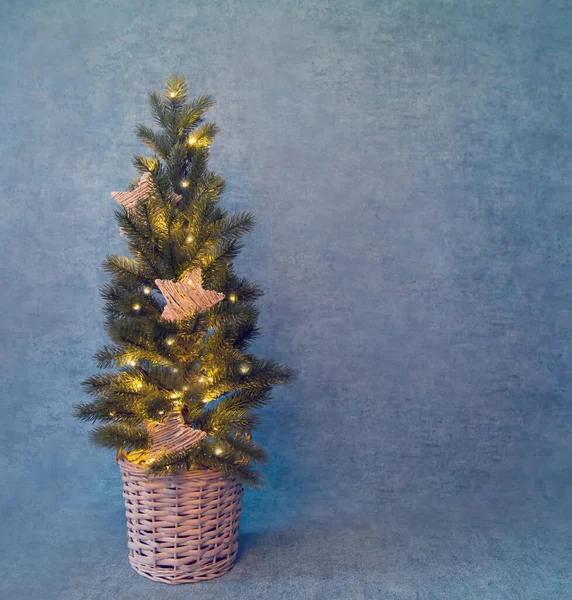 Christmas Tree Stars Yellow Lights Basket Blue Background Copy Space — Stock Photo, Image