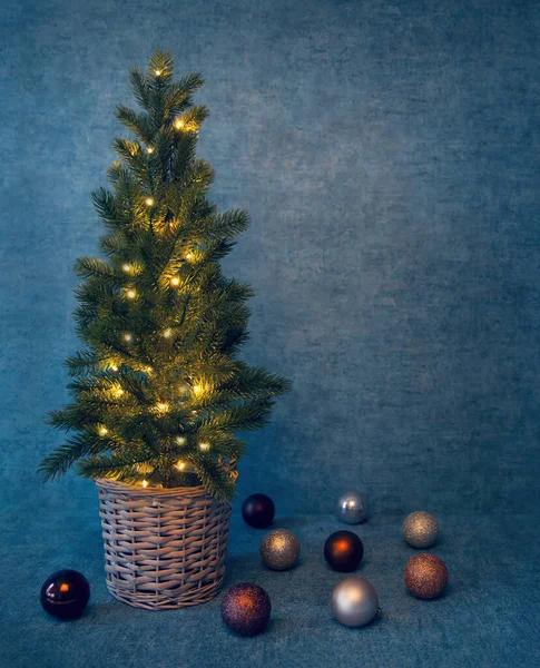 Christmas Tree Lights Basket Blue Background Copy Space — Stock Photo, Image