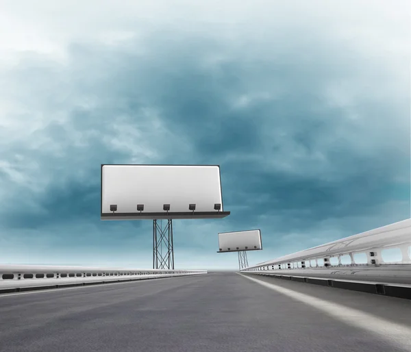 Speedway with two billboards afar with sky — Stock Photo, Image