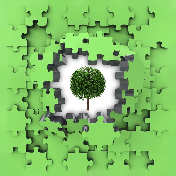 Green puzzle jigsaw with leafy tree revelation — Stock Photo, Image