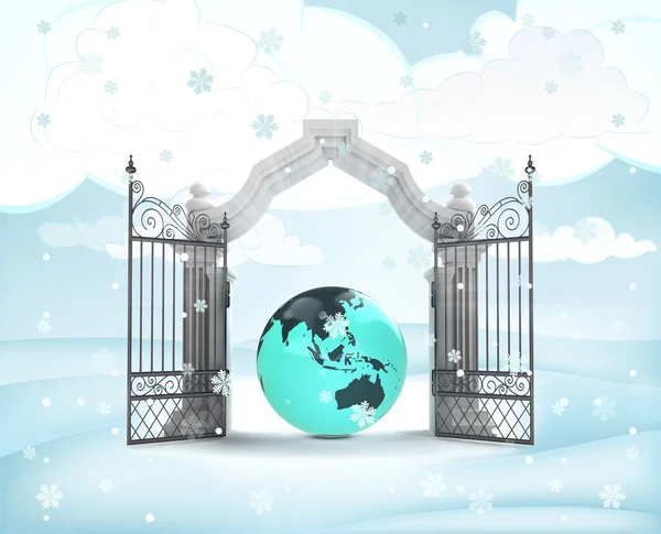 Xmas gate entrance with asia earth globe in winter snowfall — Stock Photo, Image