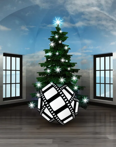 Hemelse kamer met film tape geschenk onder glinsterende kerstboom — Stockfoto