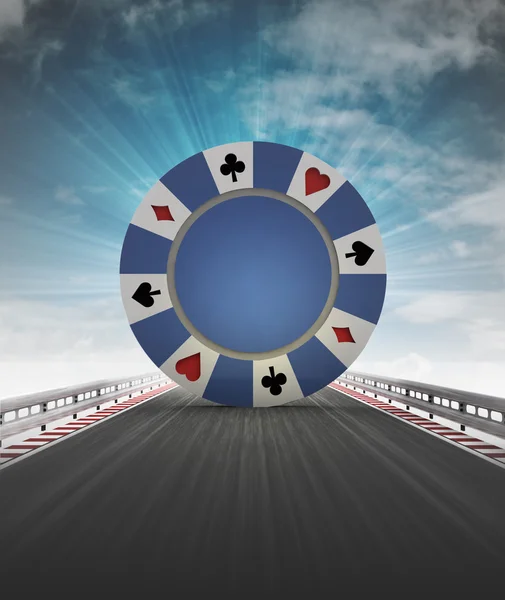 Poker chip on motorway track leading to casino with sky flare — Stock Photo, Image