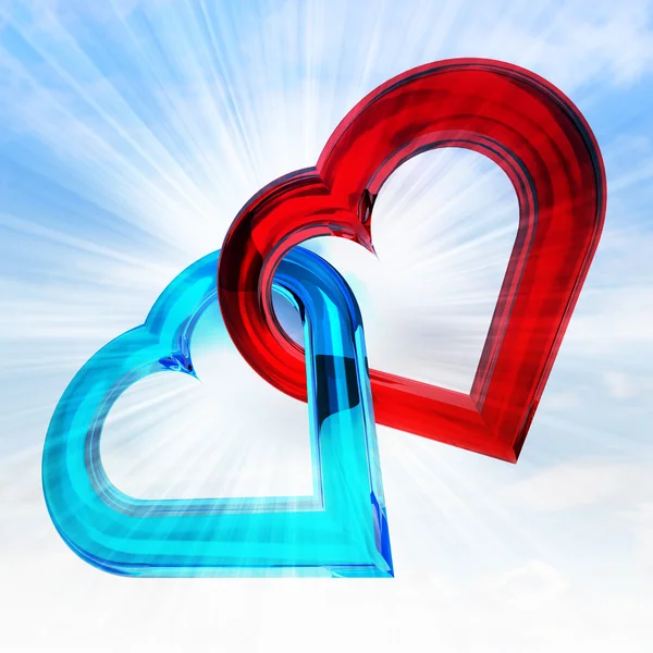 Rood en blauw glazig hart samen in hemel flare — Stockfoto
