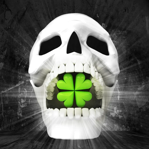 Human skull with clover leaf in jaws — Stock Photo, Image