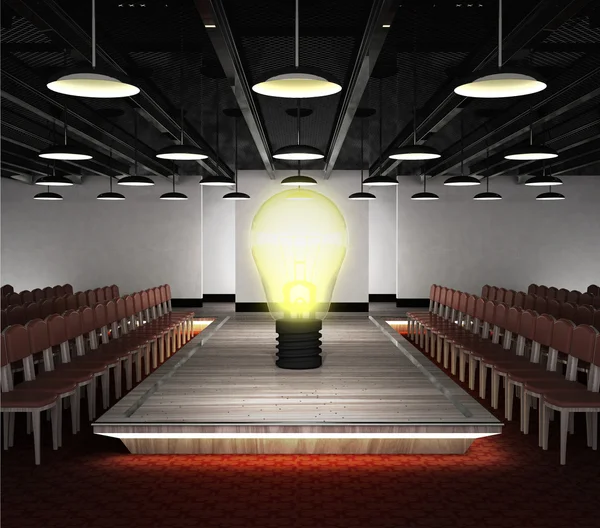 Yellow bulb situated on fashion podium — Stock Photo, Image