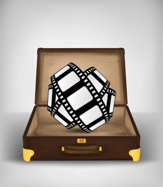 Filmové pásky roll v otevřené cestovní kufr — Stockový vektor