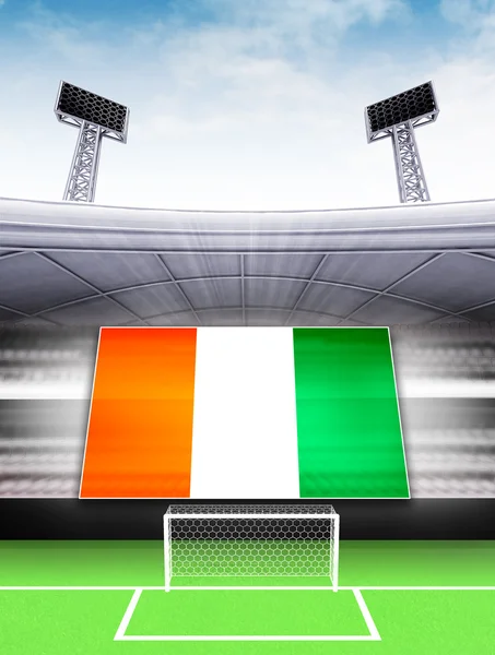 Банер Прапор Кот-д'Івуар в сучасний футбольний стадіон — стокове фото