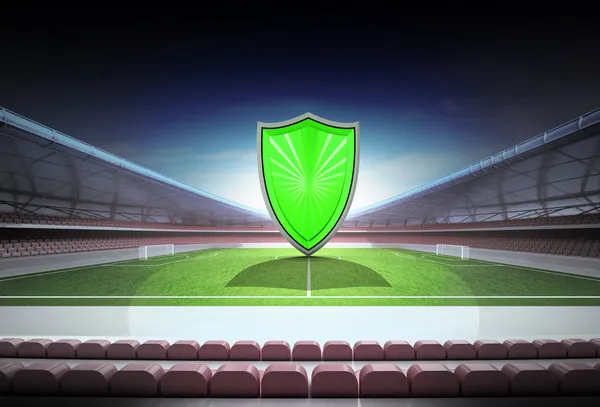 Escudo verde no meio do campo do estádio de futebol mágico — Fotografia de Stock