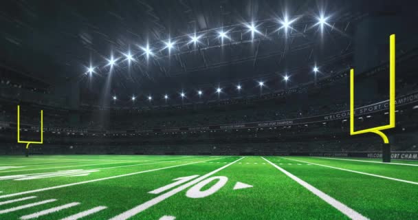 American Football Stadium Yellow Goalposts Grass Field Glowing Spotlights Camera — Stock Video