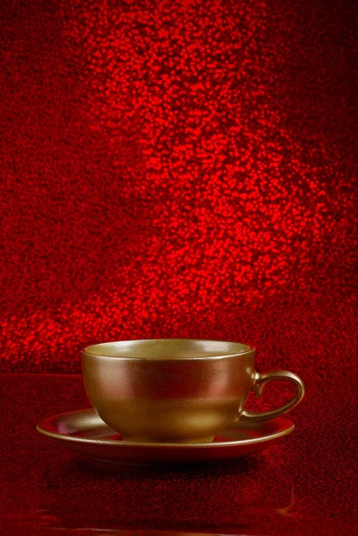 Gold cup of coffee — Stock Photo, Image