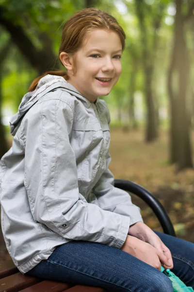 A child goes for a walk with an umbrella from a rain — Stock Photo, Image