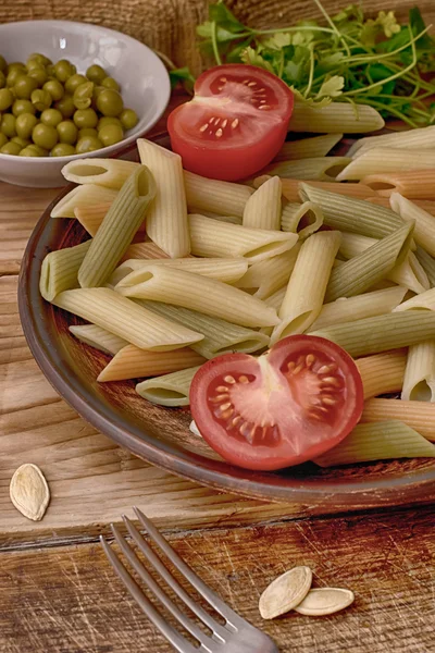 Pasta italiana and tomatoes — Stock Photo, Image