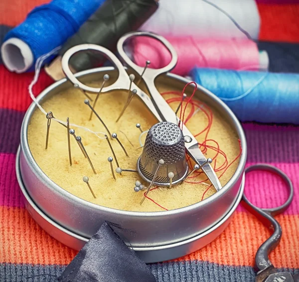 Box with needles and scissors — Stok fotoğraf