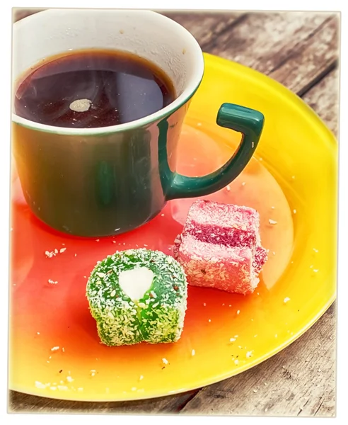 Mug with coffee and candy — Stock Photo, Image