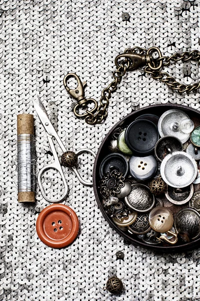 Buttons and zipper on the background of sewing tool — Stock Photo, Image