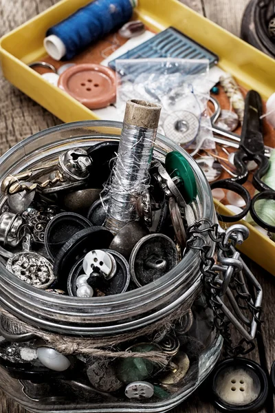 Buttons and zipper on the background of sewing tool — Stock Photo, Image