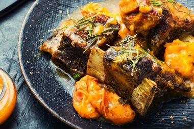 Appetizing meat stew in apricots. Homemade dinner, juicy beef meat