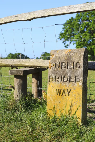 Engraved weathered stone sign for a public bridle way — Stock Photo, Image