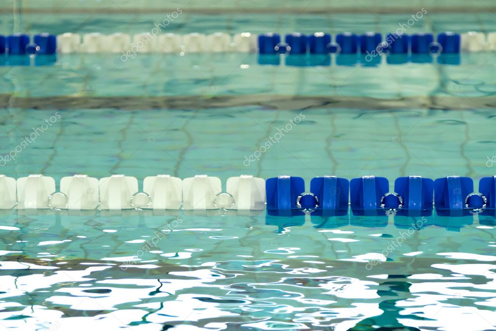 Empty swimming pool with blue and white lane dividers Stock Photo