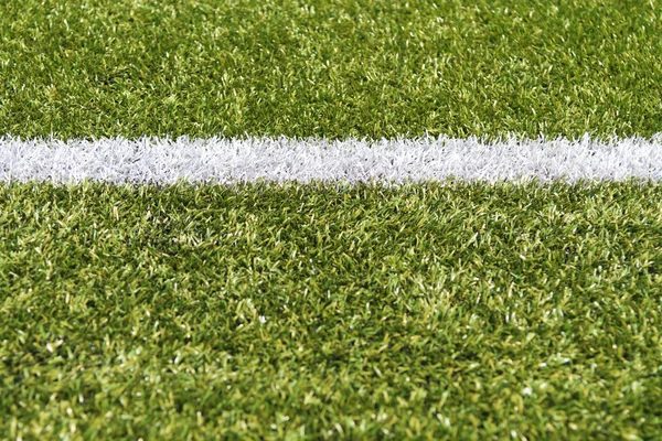 White stripe on a green artificial field — Stock Photo, Image