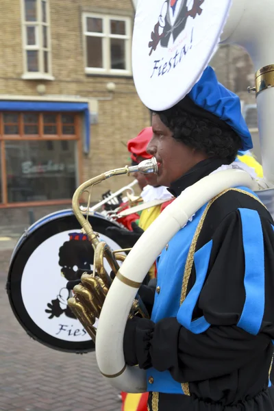 Marching band dressed as Zwarte Piet — Stock Photo, Image