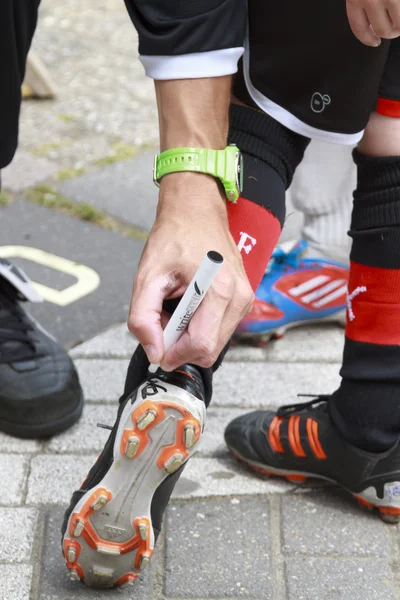 Voetbal boot ondertekening — Stockfoto