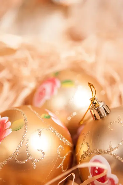 New year background with boll and strow in gold — Stock Photo, Image