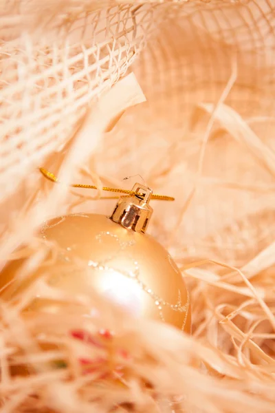 New year background with boll and straw in gold — Stock Photo, Image