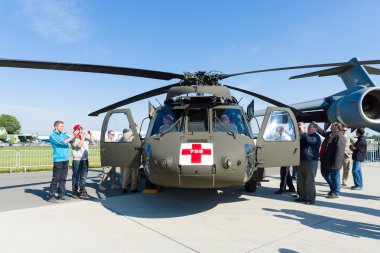 Visitors view the helicopter Sikorsky HH-60 Blackhawk (USAF) clipart