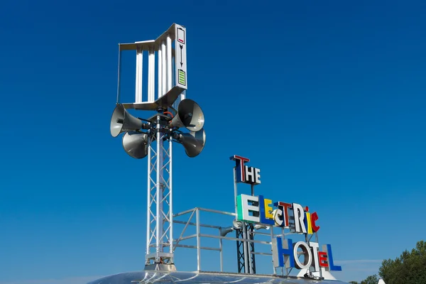 A sign "The electric hotel" - ecological power plant — Stock Photo, Image